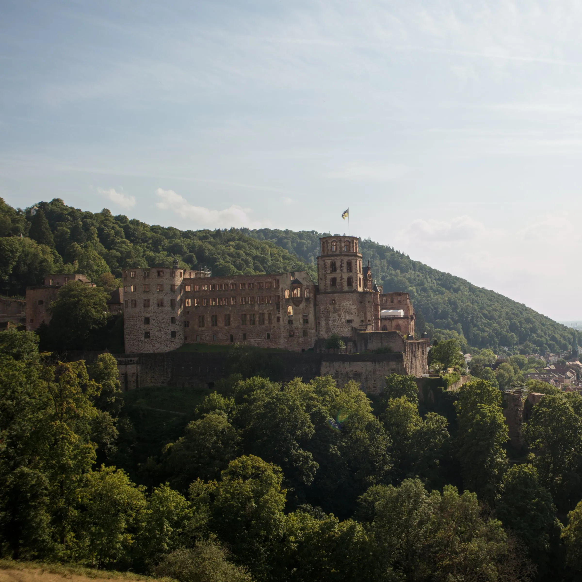 Panoramic sunset view of Heidelberg Castle overlooking the Neckar River